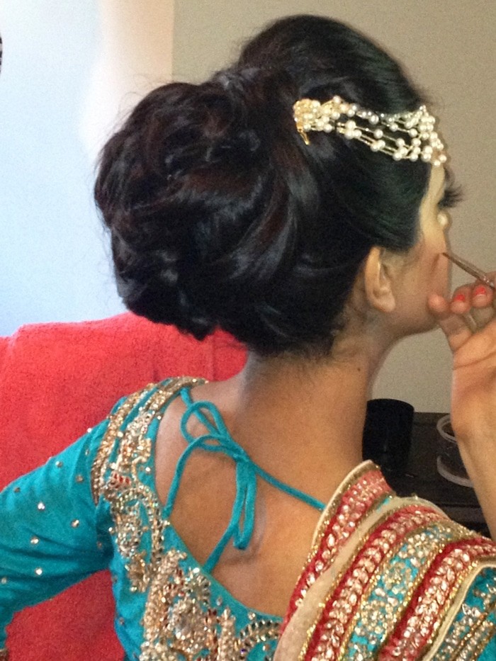 A hair bun full of volume for this bride's wedding ceremony in Bellmore, NY