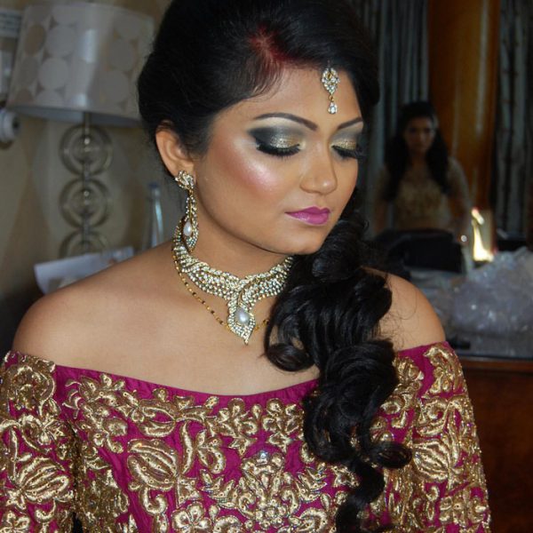 Beautiful bride with her reception look at Chateau Briand - bridal hair and makeup by Naz Beauty