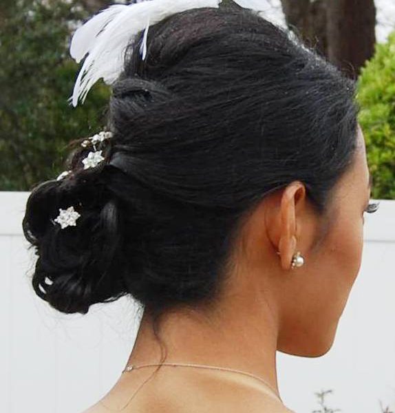 French braided bun for this bride's wedding in Garden City - bridal makeup and hair by Naz Beauty