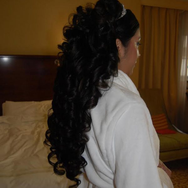 Two sets of hair extensions used to create this type of volume on this bride's wedding day at the Woodbury Country Club